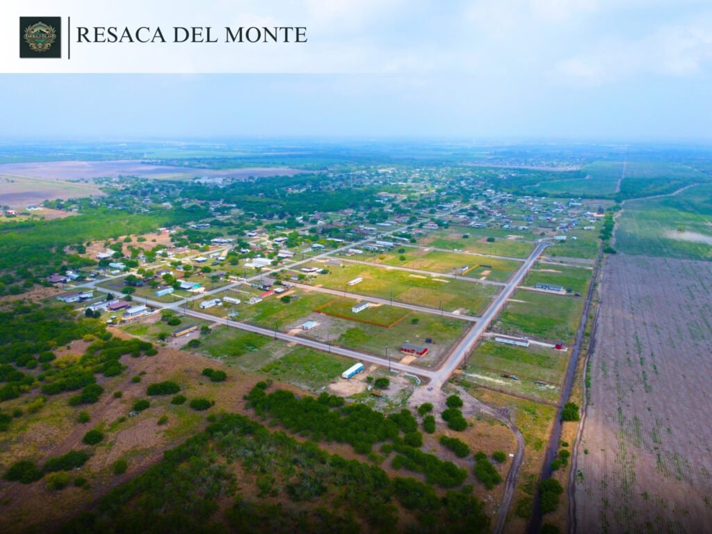 Aerial view of rural housing and fields.